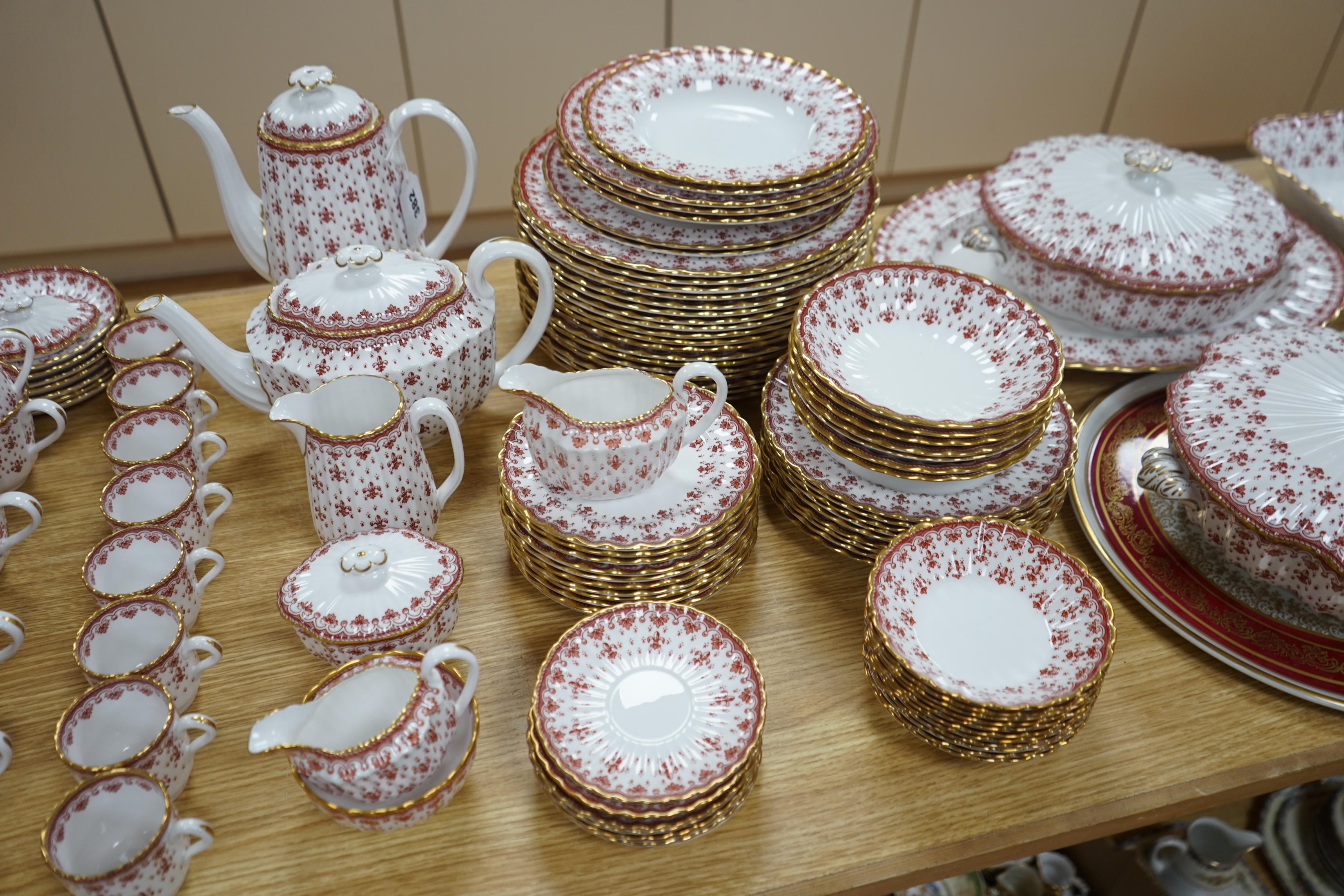 An extensive Spode fine bone china ‘Fleur De Lys Red’ tea, coffee and dinner service, including tureens, tea and coffee pots